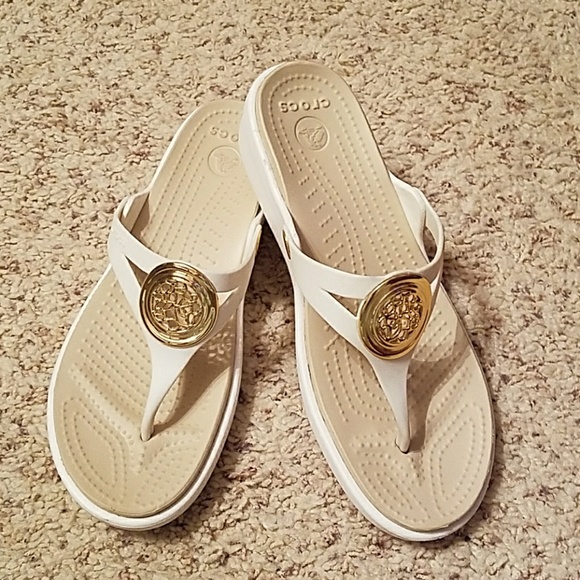 crocs gold flip flops
